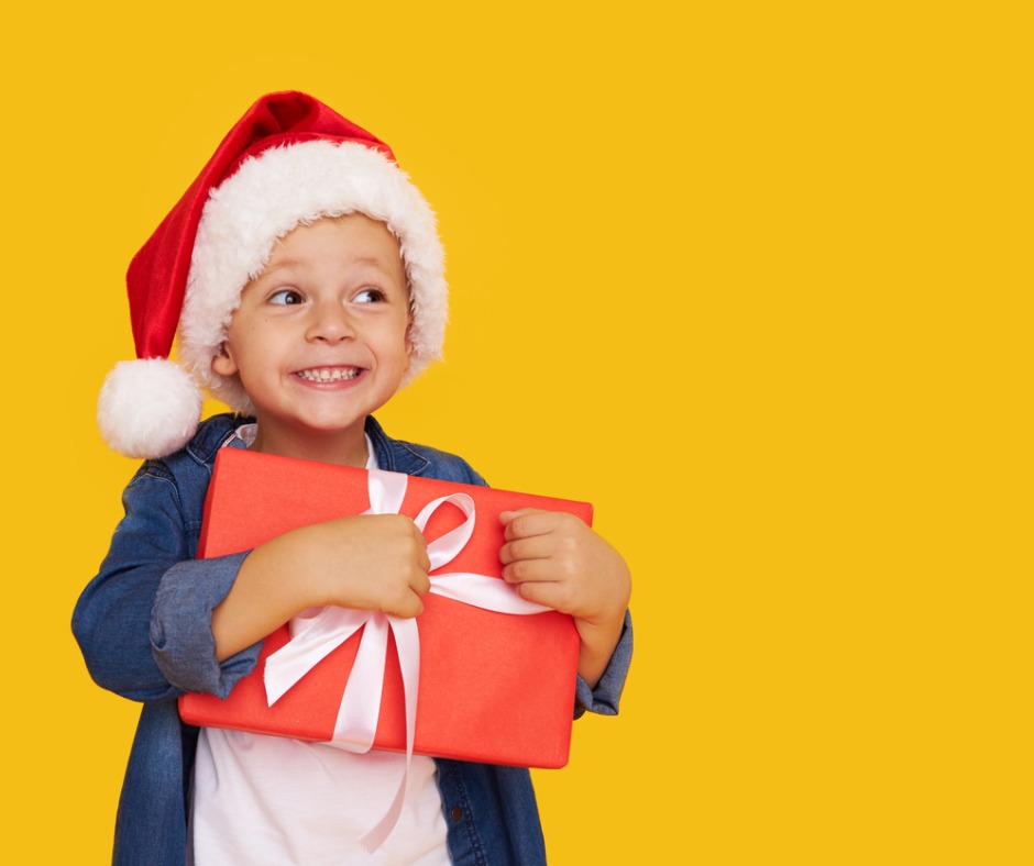 portrait-of-a-satisfied-little-child-boy-in-christmas-santa-hat-picture-id1279751552.jpg